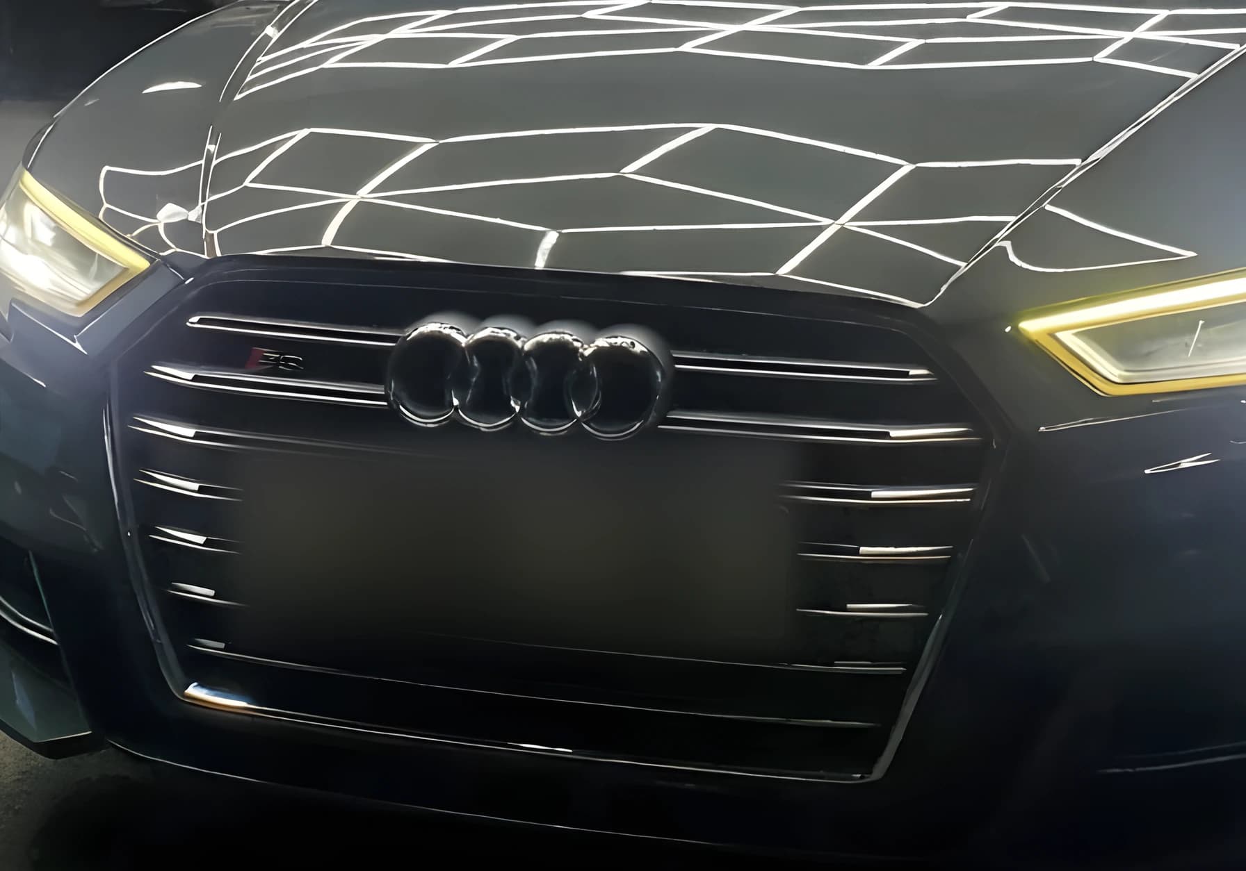 Close detail of a cleaned grille and front bumper