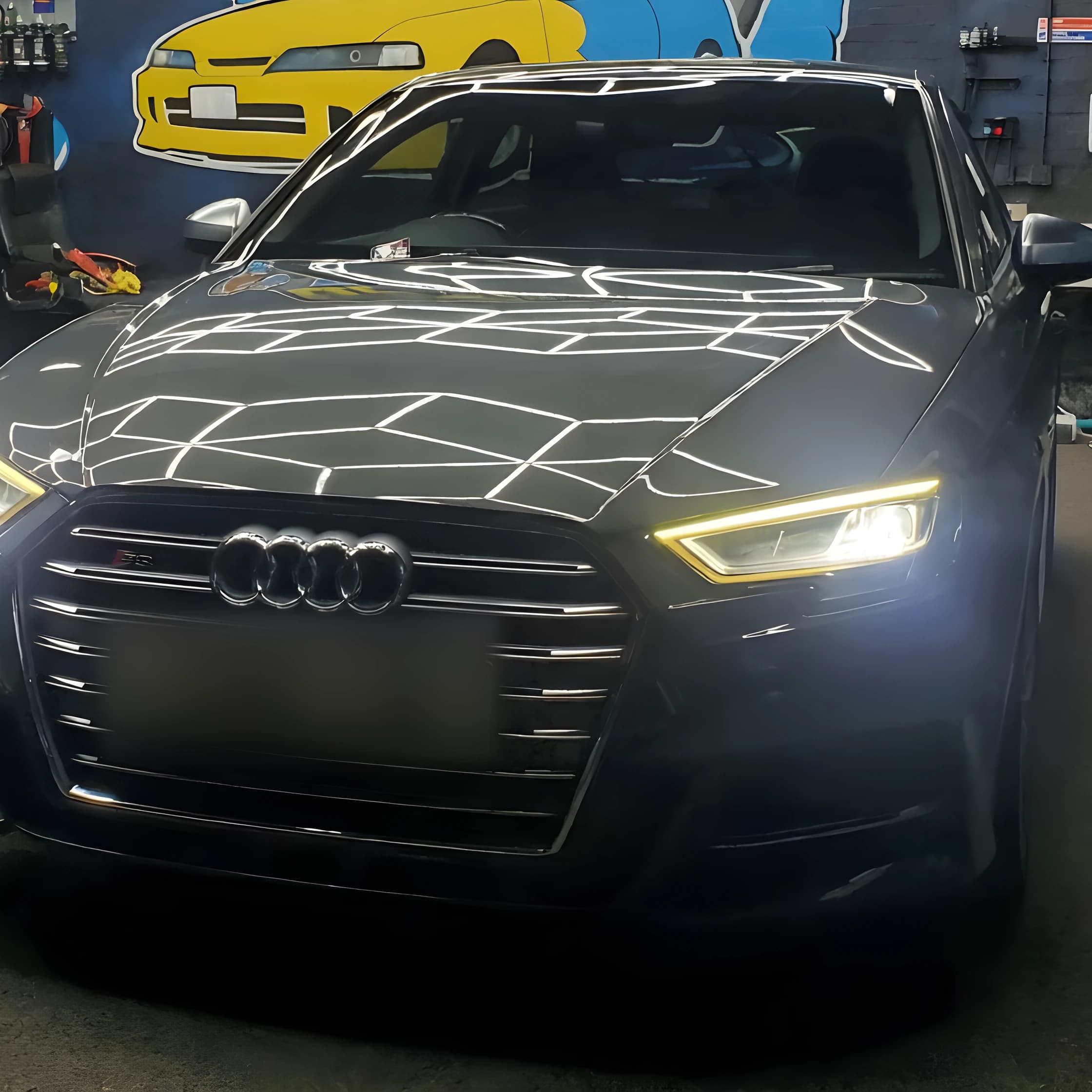 Deep gloss on the bonnet of a dark saloon at Optimum Detailing