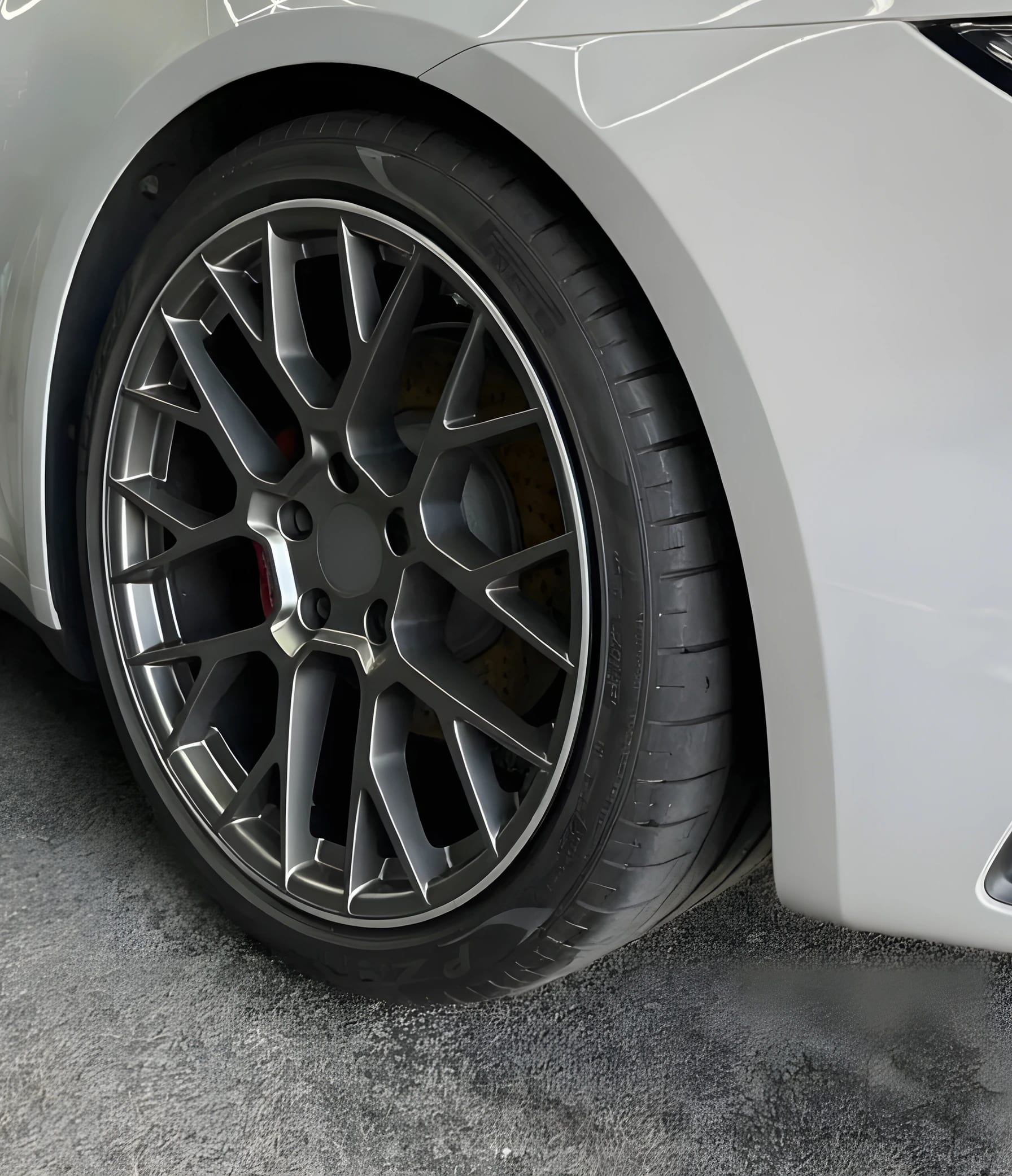 Close detail of a freshly cleaned alloy wheel, tyre and arch
